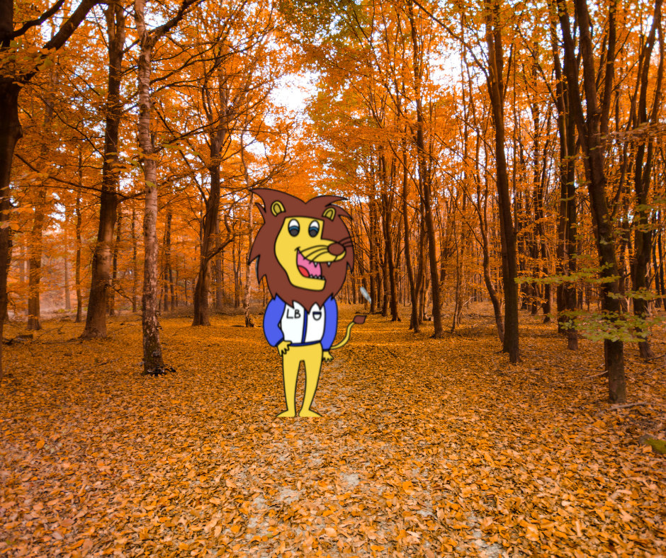 Picture of our mascot in a forest with fall leaves